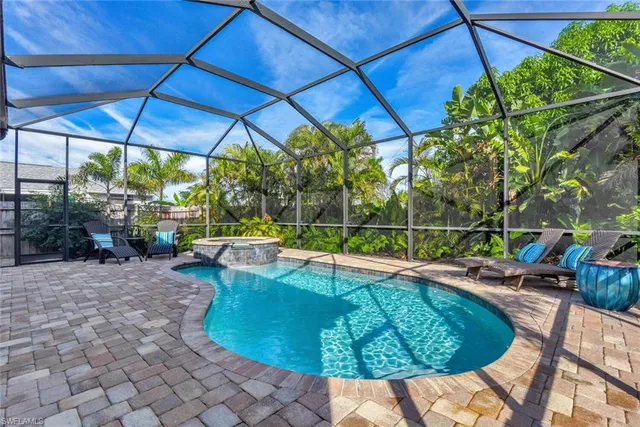 a view of a swimming pool with a patio