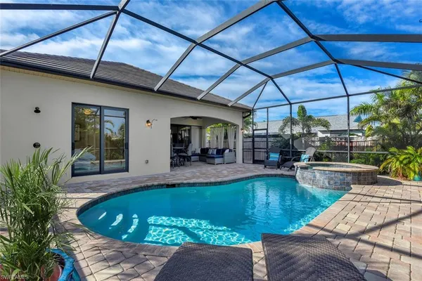 a view of swimming pool with seating space