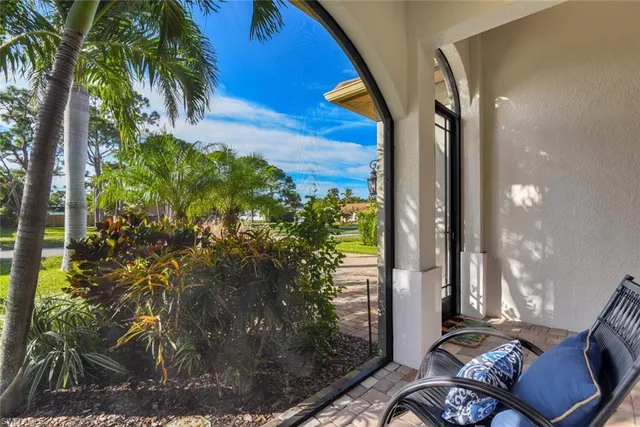 a backyard of a house with outdoor seating