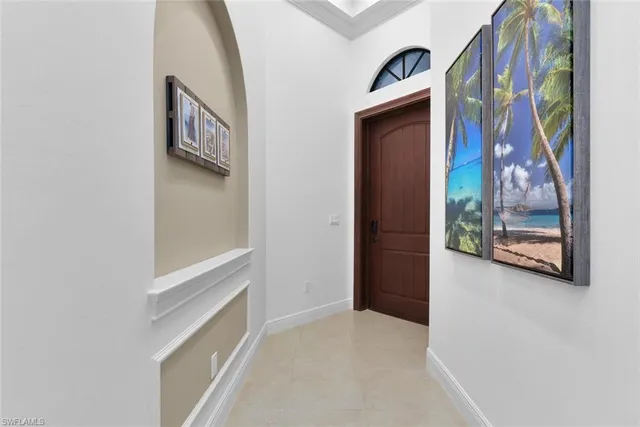 a view of an entryway with wooden floor