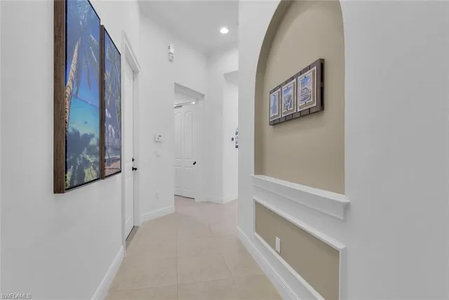 a hallway with windows and stairs
