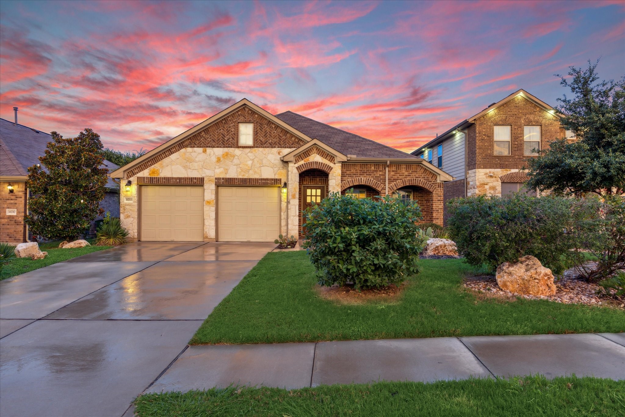 11713 Arran Street Austin, TX 78754 - Photo 1 of 1 a front view of a house with a yard and garage
