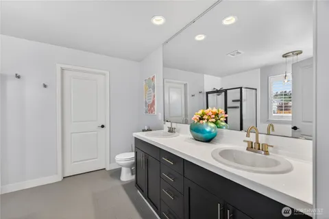 a bathroom with a sink double vanity and a mirror