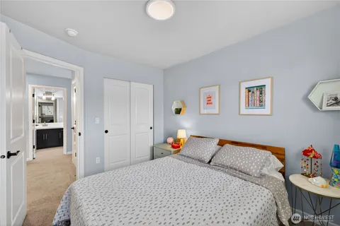 a bedroom with a bed and closet