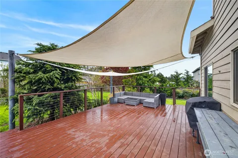 a view of a wooden deck with a yard