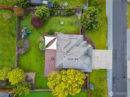 an outdoor space with seating area and swimming pool view