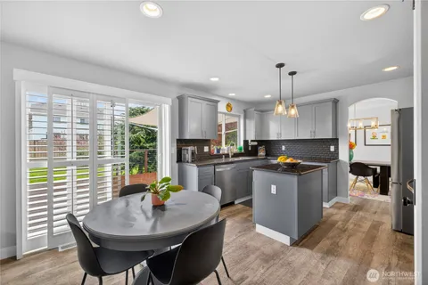 a large kitchen with a counter space a sink and appliances