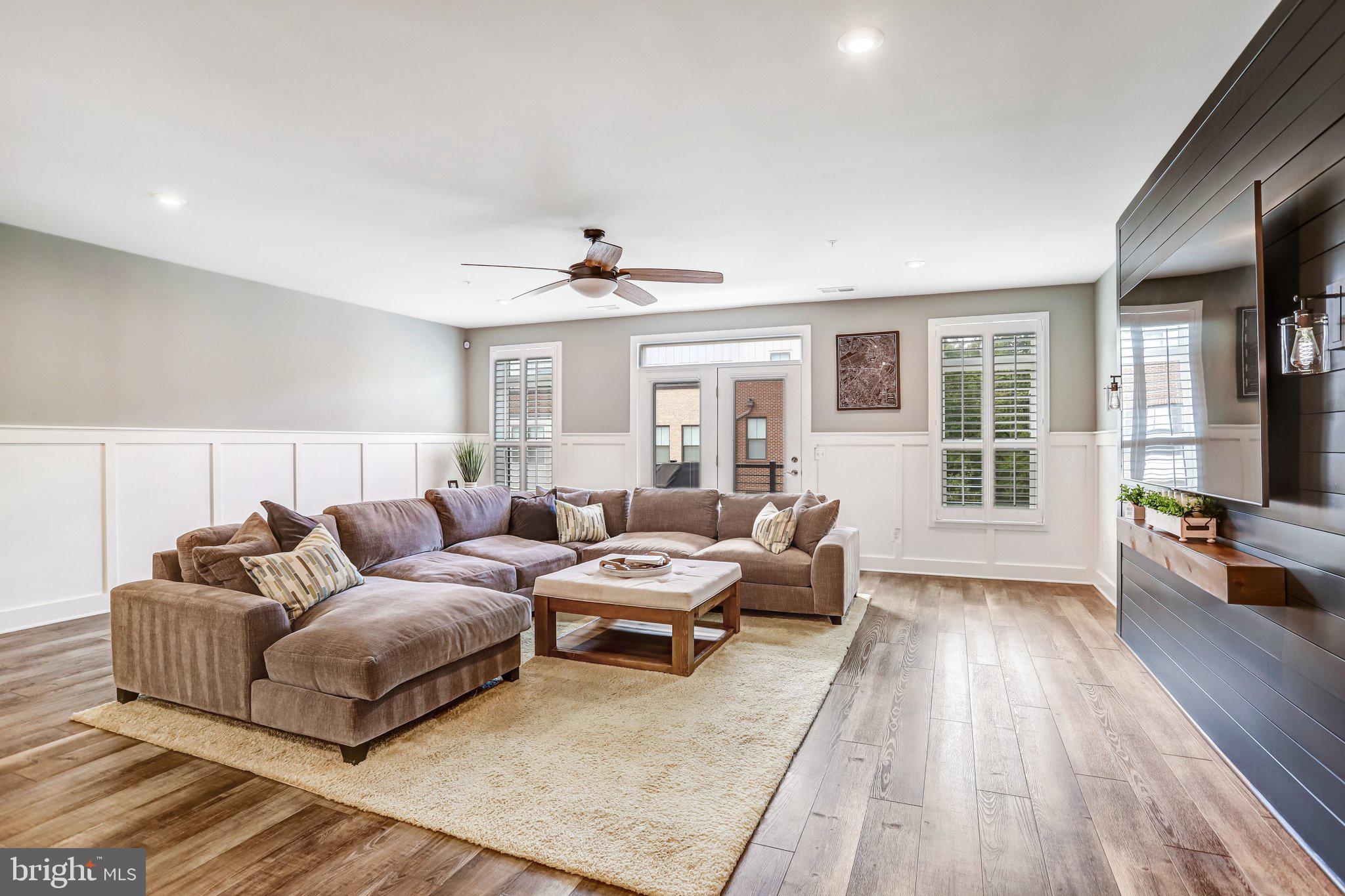 1662 Bandit Loop, Unit 3B Reston, VA 20190 - Photo 3 of 47 Great Room accented by custom board & batten trim