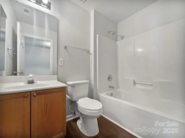 a bathroom with a toilet a sink and a bathtub