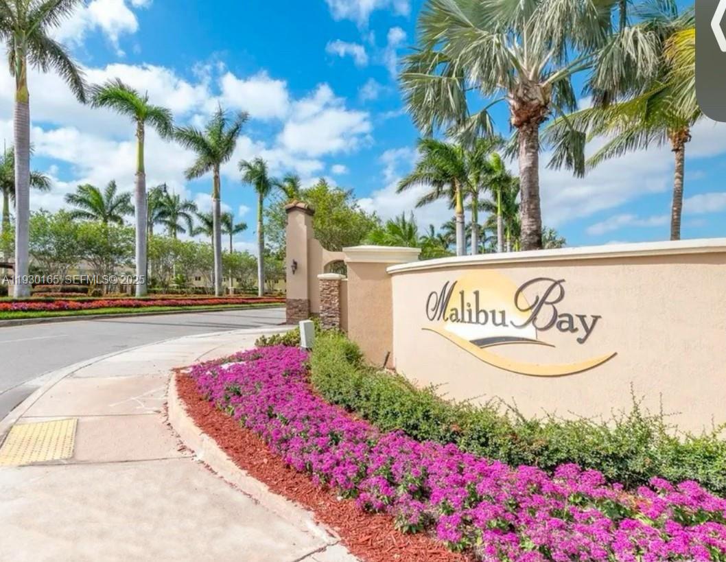 1398 Northeast 33rd Avenue, Unit 10825 Homestead, FL 33033 - Photo 2 of 8 a sign on the side of a building