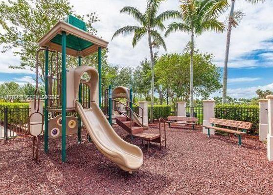 1398 Northeast 33rd Avenue, Unit 10825 Homestead, FL 33033 - Photo 7 of 8 an outdoor space with furniture and garden