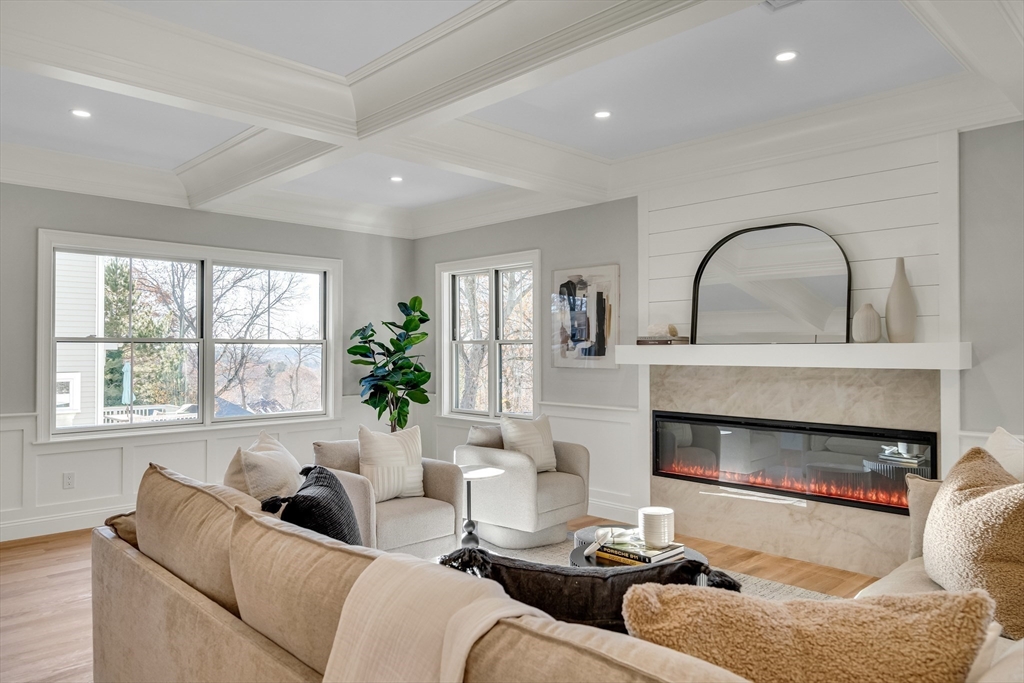 24 Deering Avenue Lexington, MA 02421 - Photo 15 of 42 a living room with furniture a window and a fireplace