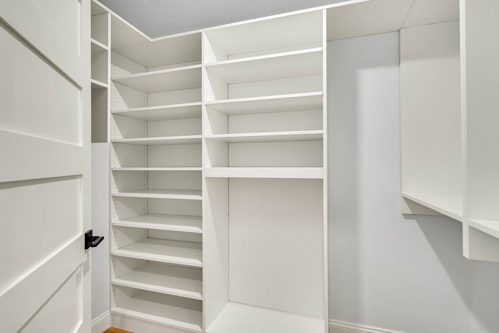 24 Deering Avenue Lexington, MA 02421 - Photo 23 of 42 a view of walk in closet with empty racks