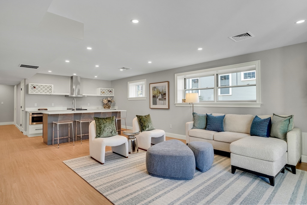 24 Deering Avenue Lexington, MA 02421 - Photo 35 of 42 a living room with furniture and a table