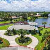 an aerial view of a house with swimming pool lake view and mountain view
