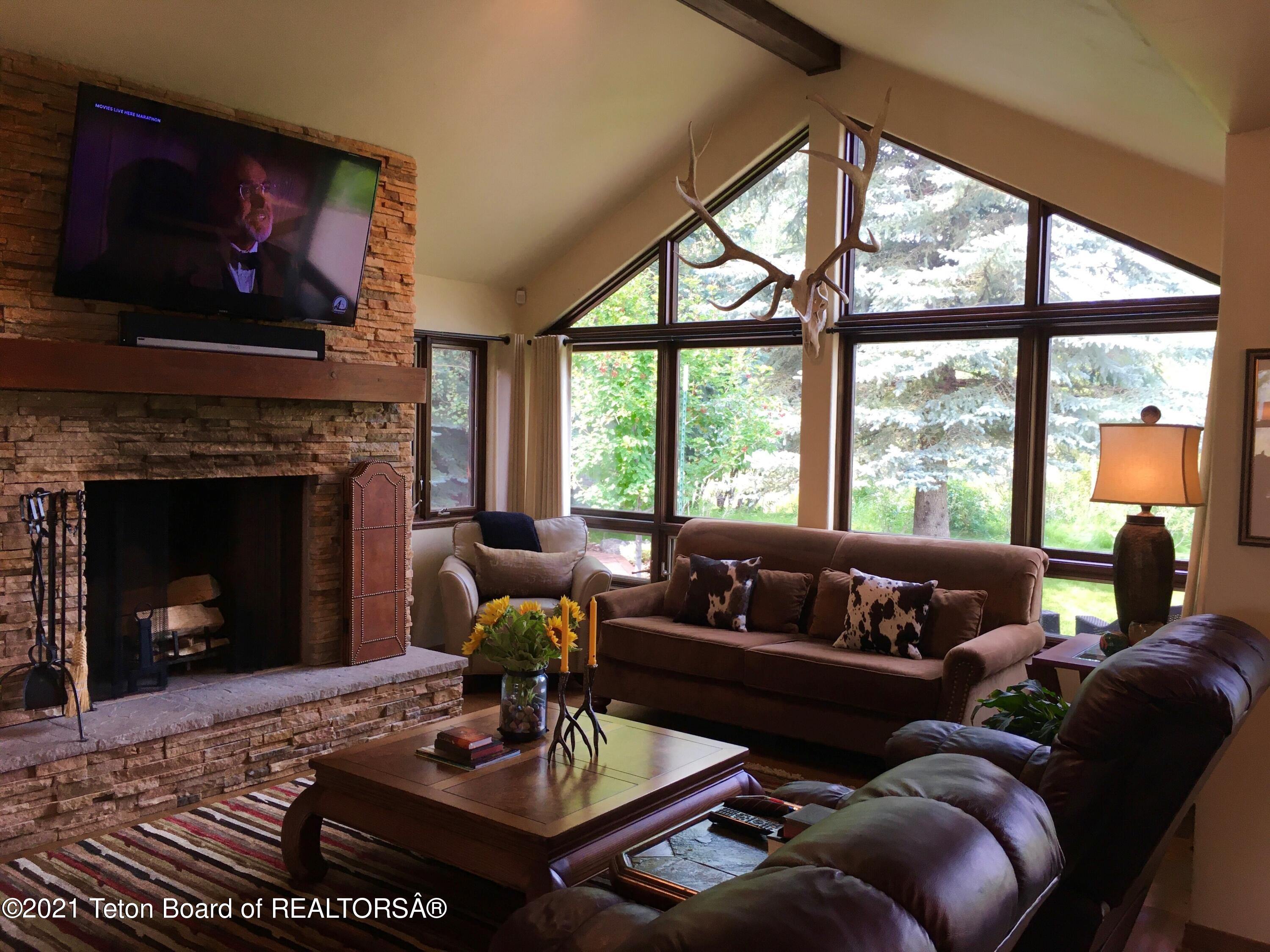 6355 North Spring Gulch Road Jackson, WY 83001 - Photo 1 of 1 Living with fireplace
