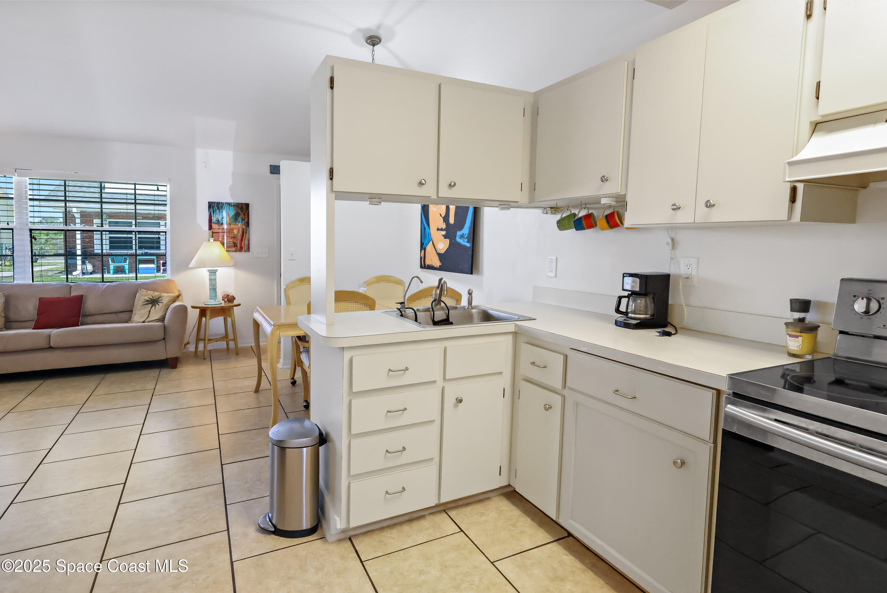 8520 U.S. Rte 1, Unit G3 Micco, FL 32976 - Photo 6 of 12 a kitchen with a cabinets and appliances