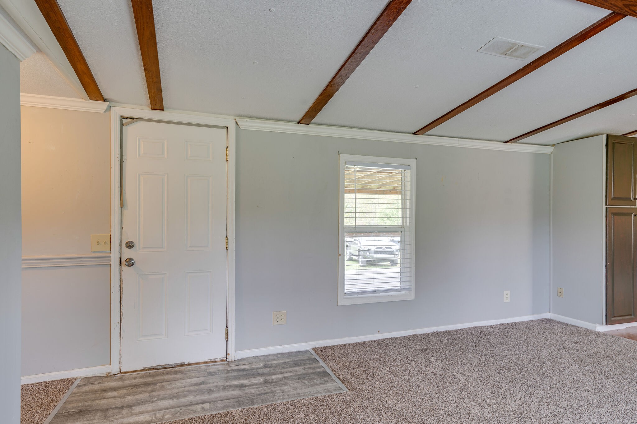 2031 Sugar Camp Road Springfield, TN 37172 - Photo 24 of 42 a view of an empty room with wooden floor and a window