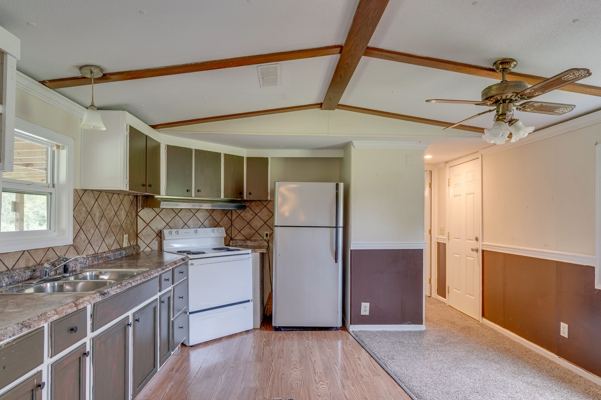2031 Sugar Camp Road Springfield, TN 37172 - Photo 28 of 42 a kitchen with a refrigerator and a sink