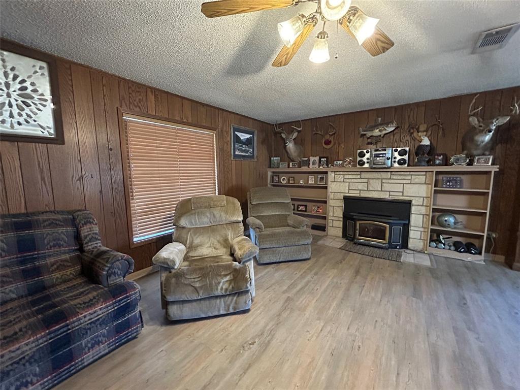 5 W Highway Goldthwaite, TX 76844 - Photo 18 of 29 a living room with furniture and a fireplace