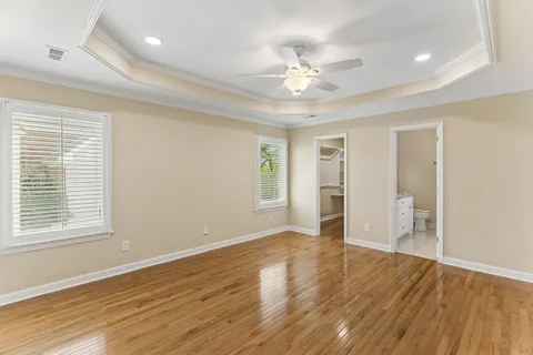 a view of an empty room and wooden floor