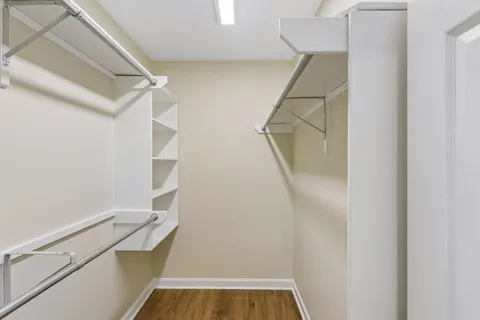 a view of a livingroom with wooden floor and closet