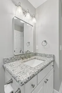 a view of a patio with a dining table and chairs with wooden floor
