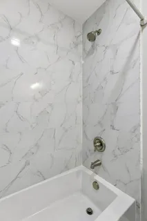 a view of a patio with a table and chairs