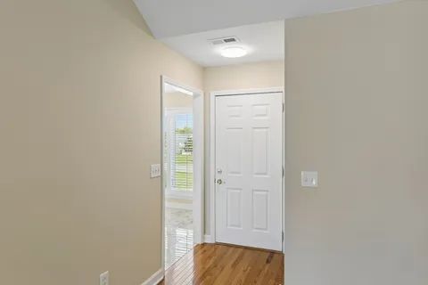 a living room with a fireplace and a table