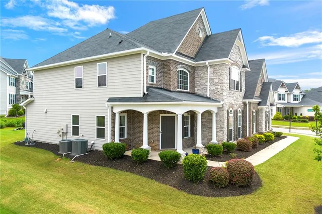 front view of a house with a yard