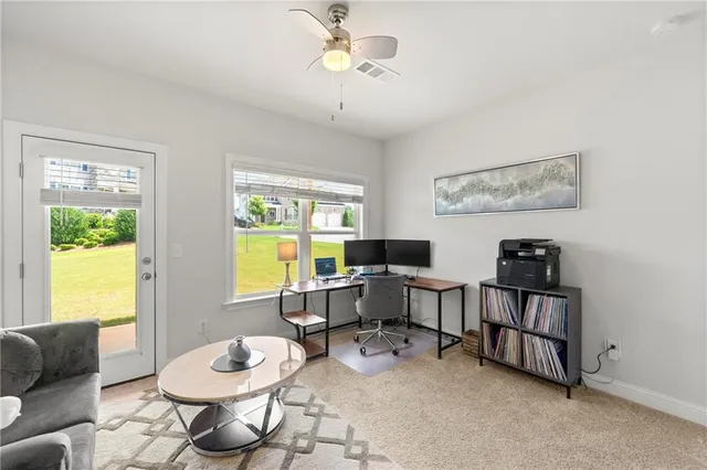 a work room with furniture and a window