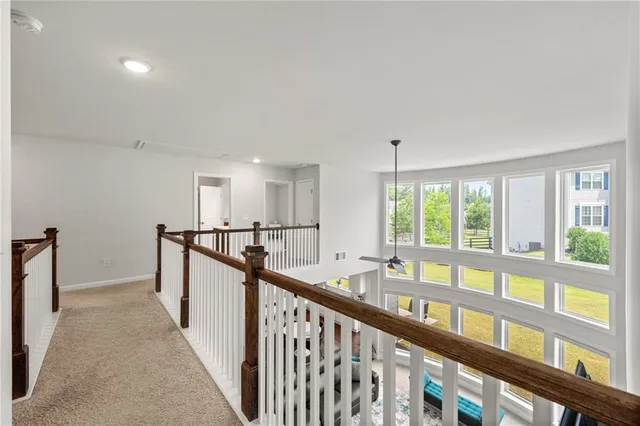 a view of an entryway wooden floor and windows