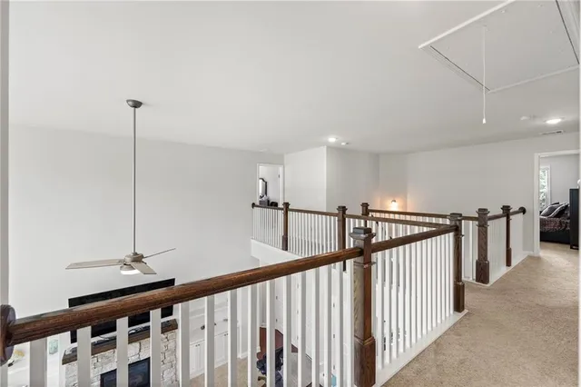 a view of a hallway with windows