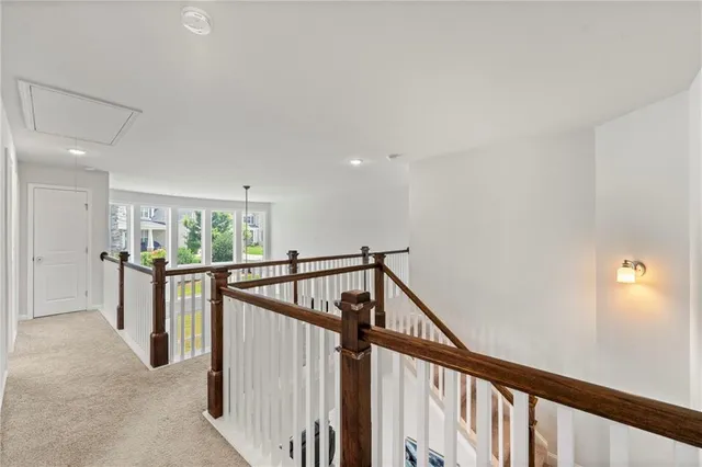 a view of a hallway with furniture