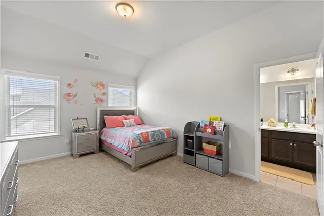 a bedroom with bed and window