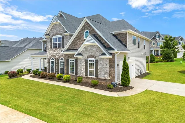 a front view of a house with a yard