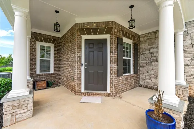 a front view of a house with stairs