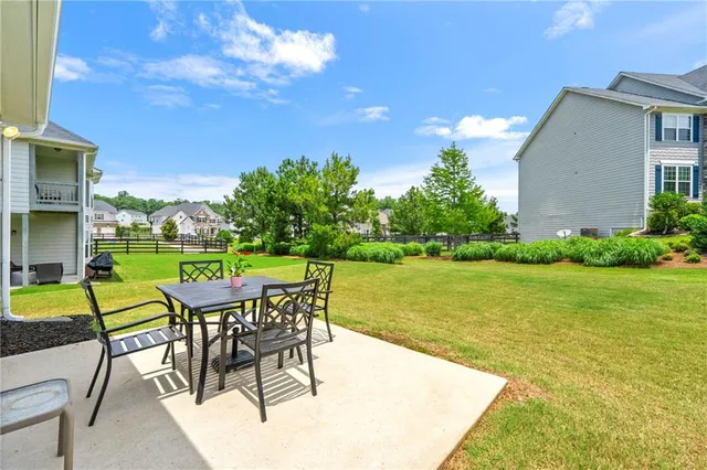 a view of a house with a garden and deck
