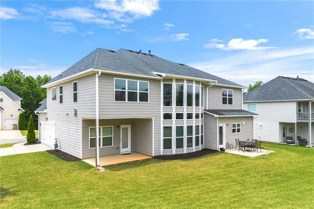 a front view of a house with a yard