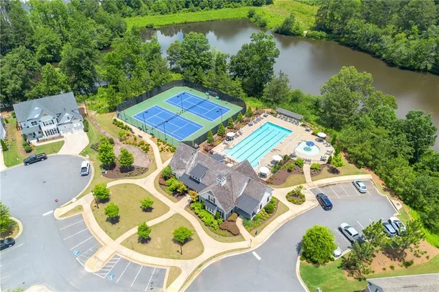 an aerial view of a house with a big yard