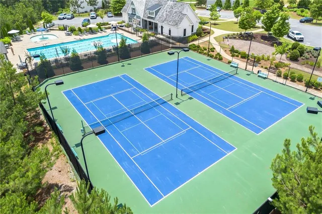 a view of a swimming pool with an outdoor space and seating area