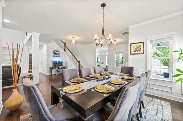 a view of a dining room with furniture window and wooden floor