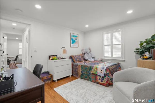 a bedroom with a bed and a couch