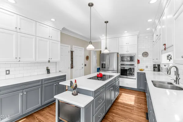 a living room with kitchen island furniture and a wooden floor