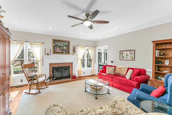 a view of a dining room with furniture wooden floor and a chandelier