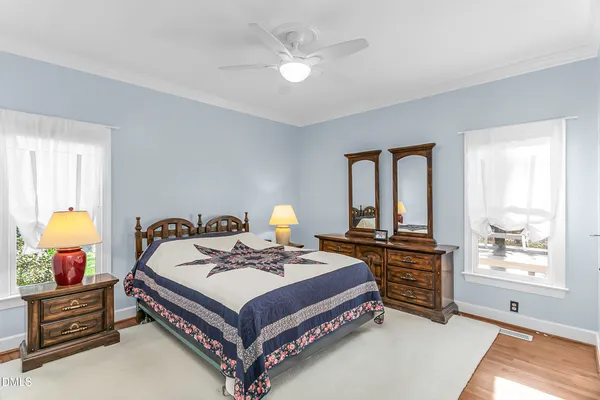 a living room with furniture and stairs