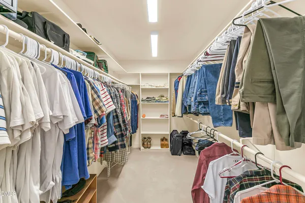 a living room with furniture a couch and dresser