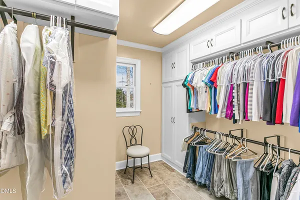 a view of a sink and dishwasher with wooden floor