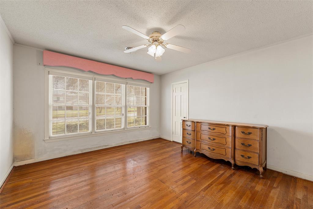 3117 Colcord Avenue Waco, TX 76707 - Photo 11 of 26 a view of an empty room with wooden floor and a window