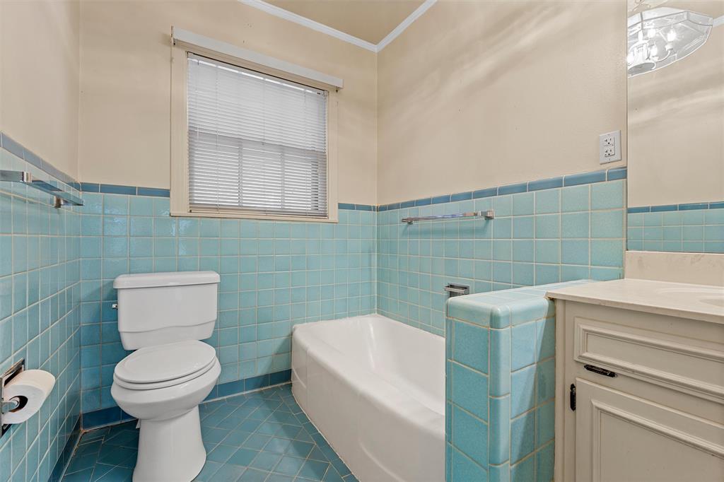 3117 Colcord Avenue Waco, TX 76707 - Photo 16 of 26 a bathroom with a toilet sink and mirror